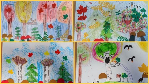Kolorowe prace uczniów narysowane kredkami, przedstawijące krajobrazy jesieni